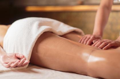 A woman’s legs being massaged to treat cellulite